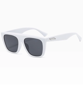 Close-up of white square sunglasses with silver metal bars on temple and grey lenses