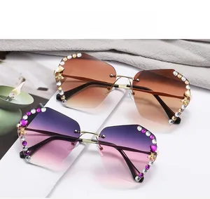 Detail of rimless gradient sunglasses with crystal studs and golden bee accents