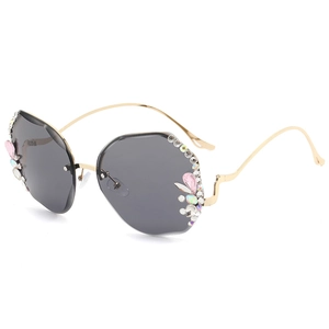 Fashionable rimless oversized gradient sunglasses with floral diamond accents and gold frame