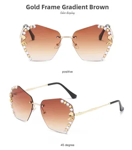 Macro detail of rimless gold sunglasses with gradient tea lenses and rhinestone bee decor
