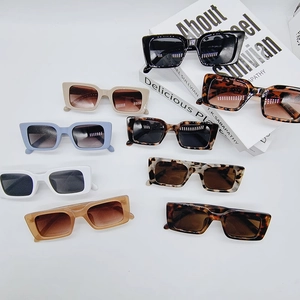 Flat lay of retro rectangle sunglasses in 8 assorted colors and leopard patterns
