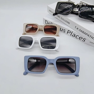 Modern rectangular sunglasses in black, beige, and matte blue shown from a 45-degree angle