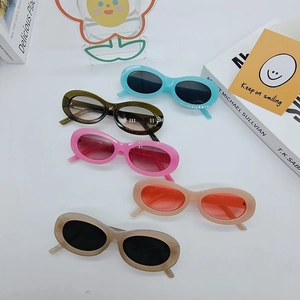 Detailed view of oval retro sunglasses in multiple pastel colors on a white background