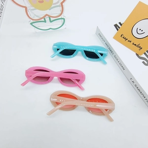 Retro Y2K oval sunglasses with glitter translucent frames in pink and blue tones