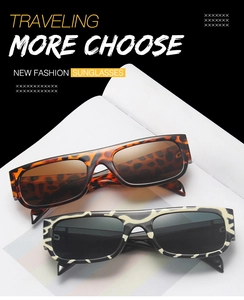 Detail of trendy rectangle sunglasses in leopard and zebra print frames with gradient lenses