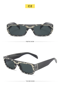 Macro view of C2 hip-hop sunglasses with black and white camo pattern frame and grey lenses