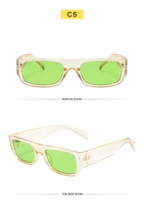 Macro detail of retro narrow sunglasses with champagne frames and neon green lenses