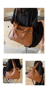 Detail of caramel tote bag showing vintage leather texture and riveted front pocket