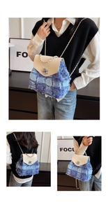 Detail eines Tweed-Patchwork-Rucksacks mit silbernem Kamelien-Verschluss und Kette
