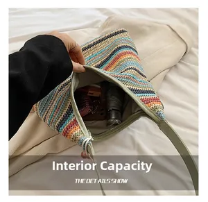 Detail showing the large interior capacity of this rainbow striped woven tote bag