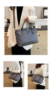 Detail of the CLEAROX grey-blue nylon tote bag with leather trim and shoulder strap