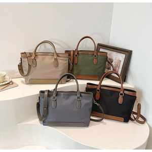 Nylon tote bags in khaki, green, blue and black with leather trim and gold hardware