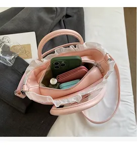 Top view of pink ruffle bag interior showing spacious storage for phone and wallet