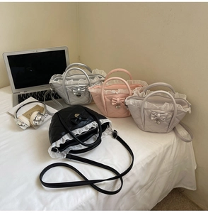 Detailed group view of quilted quilted tote bags with ruffle trim and bow accents