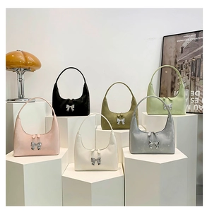 Close-up of minimalist semi-circular PU leather handbags in six trendy pastel colors