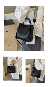 Détail du sac cabas en cuir noir avec bandoulière large à motifs géométriques amovible