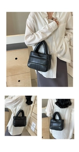 Detailed look at the black quilted puffer bucket bag with chain strap and handle