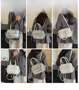 Detailed views of women's mini backpack with fringe zippers in silver and white leather