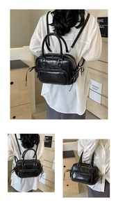 Detail of a versatile black faux leather backpack and handbag showing adjustable straps