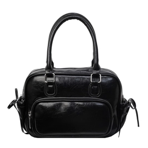 Retro black glossy pleated backpack for women featuring silver hardware and side bow details
