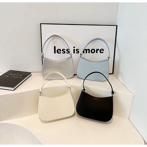 Minimalist leather underarm bags in four colors with adjustable straps and U-shaped design