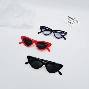Three pairs of kids cat-eye sunglasses in red and black colors on white background
