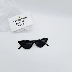 Close-up of sleek black cat-eye sunglasses for kids with stylish triangle frame design
