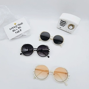 Kids round pearl sunglasses in black and orange gradient lenses with gold metal temples