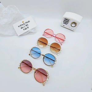 Kids round sunglasses with pearl-studded frames and golden metal temples in four colors