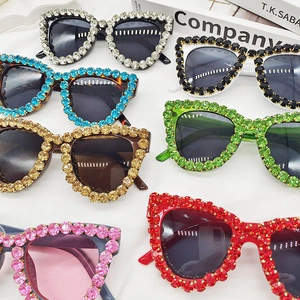Macro detail of luxury handcrafted rhinestone sunglasses in various vibrant colors
