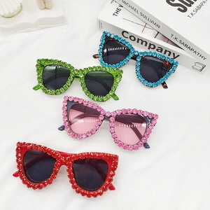 Chic cat eye sunglasses with colorful crystals in blue, green, pink, and red frames