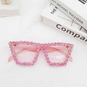 Top view of luxury oversized pink rhinestone sunglasses with crystal embellishments on frames