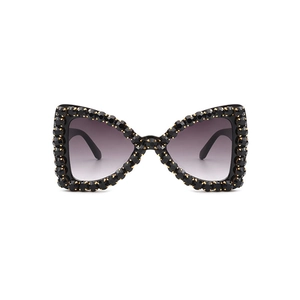 Fashionable butterfly frame sunglasses for women with black crystals and gradient lenses