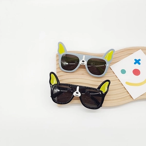 Bulldog-shaped polarized sunglasses for kids with yellow ear accents and dark lenses