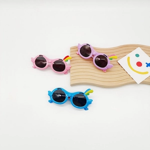 Detailed view of colorful parrot-shaped kids sunglasses with UV protection lenses