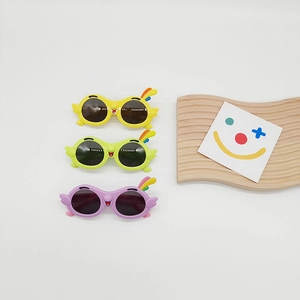 Set of three colorful parrot cartoon sunglasses for kids with UV protection and wings