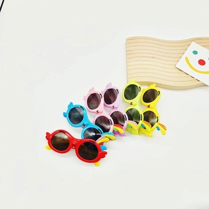 Colorful cartoon bird-shaped kids sunglasses with 3D wings and parrot design in four colors