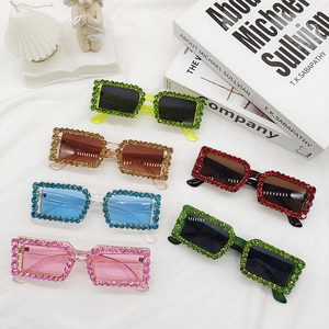 Close-up of vintage square sunglasses with sparkling colored rhinestones in six shades
