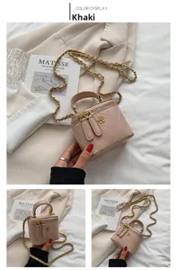 Detail of khaki quilted mini box bag with gold flower clasp and chain strap