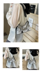 Detail of white lace overlay on black hobo bag with thick silver chain and leather strap