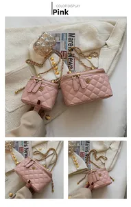 Detailed view of pink quilted leather crossbody bags with gold chain and floral zippers