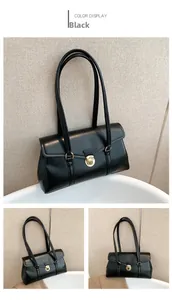 Details der schwarzen Vintage-Handtasche aus Kunstleder mit goldener Schnalle und Riemen
