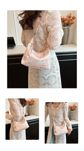 Detail of pink jacquard handbag with classical Chinese patterns and leather strap