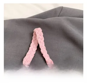 Close-up of pink woven handle showing premium knit texture and sturdy braided design