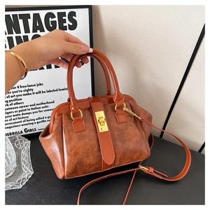 Braune Krokodilmuster Retro Kuss-Schloss Handtasche mit Schultergurt für Damen Mode.