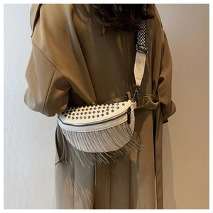 Detail of off-white rivet crossbody bag with chain fringe and chevron wide strap