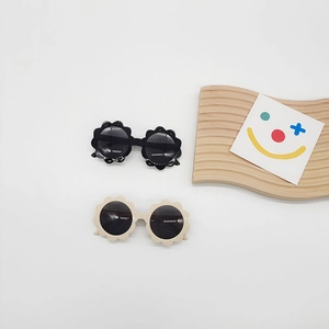 Sunflower shaped kids sunglasses in black and beige colors with UV protection