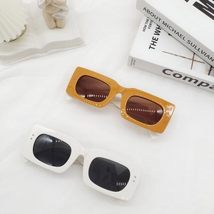 Retro rectangle sunglasses in yellow and beige frames with stylish metal corner accents