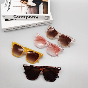 Retro square frame sunglasses in yellow, pink, champagne and tortoiseshell flat lay view