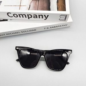 Top view of retro square sunglasses with black frames and silver metal stud details